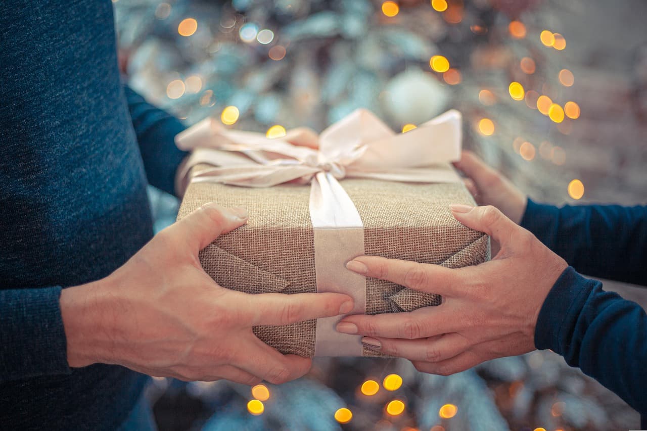 Hands offering gift